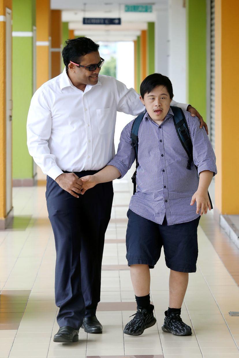 A mentor and young man walking together